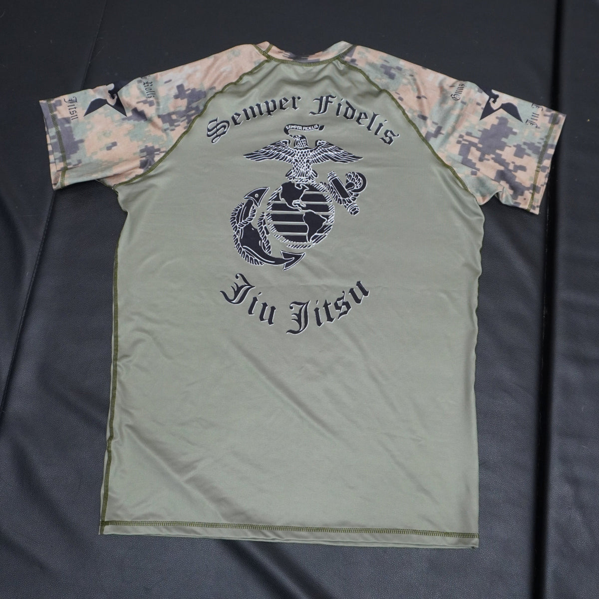 Green Marine Corps camo jiu jitsu rash guard, flat-lay photo, alternate view
