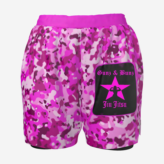Gunz & Bunz women's pink camo grappling shorts, back view with pink Gunz & Bunz Jiu Jitsu star logo on a black patch